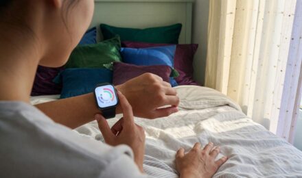 Smartphone showing sleep tracking app data with sleep stages and AI-generated insights